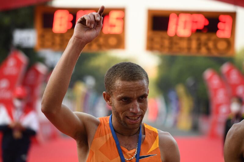 Ethiopian athlete Amedework Walelegn celebrates after winning the men's 2020 Delhi Half Marathon. AFP