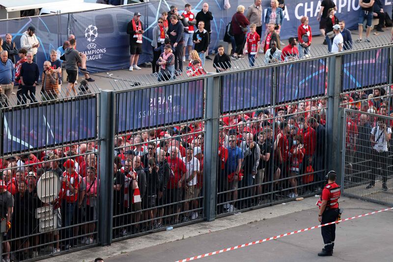 Liverpool fans stand outside the Stade de France, north of Paris, unable to enter in time for the Uefa Champions League final match against Real Madrid. AFP