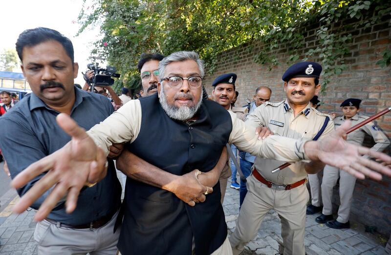 Police detain a demonstrator during a protest to show solidarity with the students of New Delhi's Jamia Millia Islamia university after police entered the university campus on Sunday following a protest against a new citizenship law, in Ahmedabad, India, December 16, 2019. REUTERS/Amit Dave