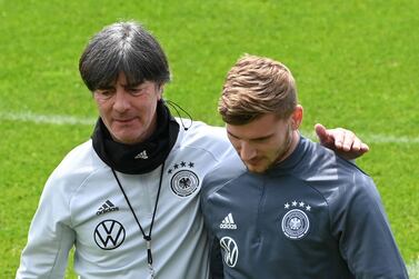 Germany's coach Joachim Loew (L) and Germany's forward Timo Werner (R) speak during a training session on June 4, 2021, in Seefeld, Austria, where the German national football team attends a training camp ahead of the European football championship 2020-2021. / AFP / Christof STACHE