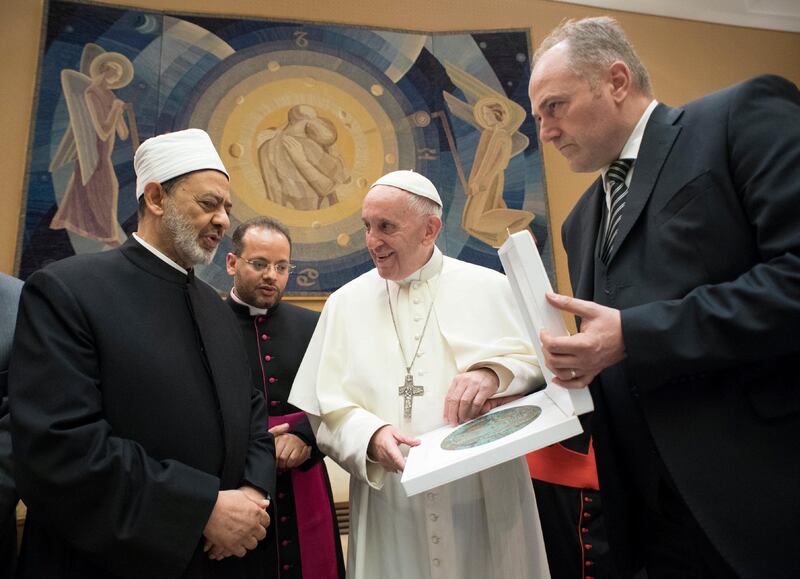 Pope Francis exchanges gifts with Grand Imam of al-Azhar Ahmed al-Tayeb during a private audience at the Vatican November 7, 2017. Osservatore Romano/Handout via Reuters ATTENTION EDITORS - THIS IMAGE WAS PROVIDED BY A THIRD PARTY. NO RESALES. NO ARCHIVE.