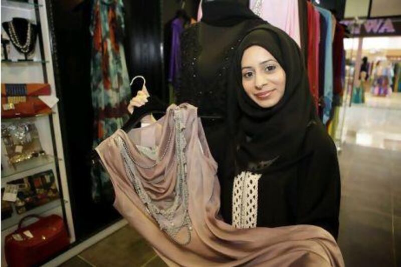 Sumayya al Suwaidi designs clothing for women and sells her products in her Grafika boutique in Abu Dhabi. Sammy Dallal / The National