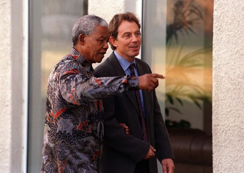 Former British prime minister Tony Blair with former South African president Nelson Mandela at the Commonwealth Heads of Government meeting retreat at St. Andrews golf course in Scotland in 1997. Mike Bowers/Fairfax Media