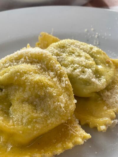 Tortelli generously sprinkled with Parmigiano Reggiano at Osteria Dei Servi in Parma. Farah Andrews / The National