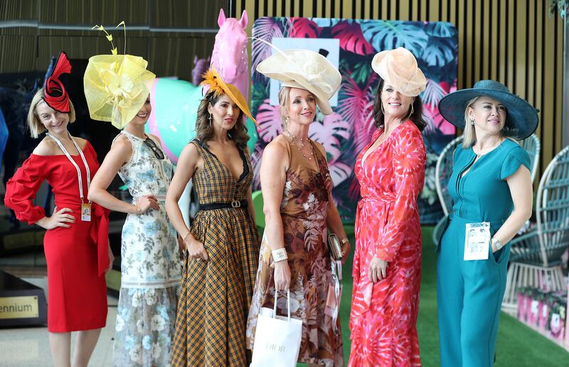 Women show off their statement dresses at Dubai World Cup. Pawan Singh / The National