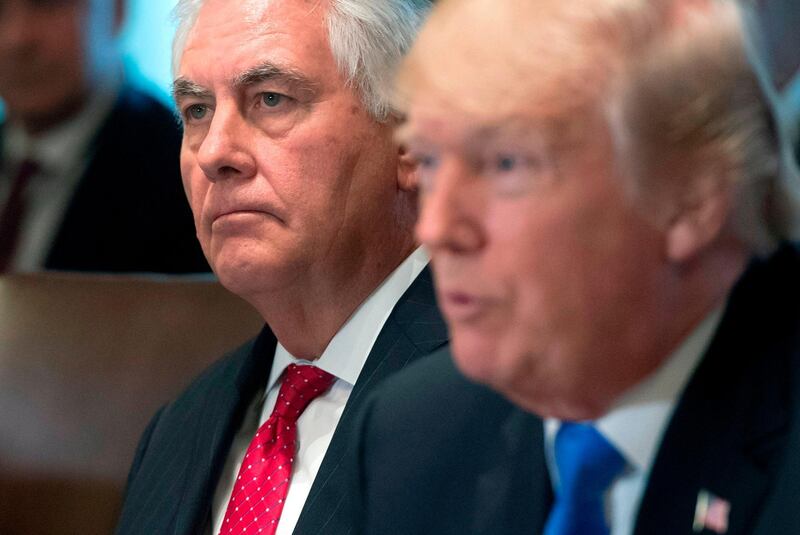 (FILES) In this file photo taken on December 20, 2017, US President Donald Trump speaks alongside Secretary of State Rex Tillerson (L) during a Cabinet Meeting in the Cabinet Room at the White House in Washington, DC. Tillerson says that Trump repeatedly wanted to violate the law, describing him as "undisciplined" and uninterested in details. Tillerson, who was fired in March, made no attempt to deny his poor relationship with Trump during a rare interview on December 6, 2018, as part of a charity dinner in his native Texas.
 / AFP / SAUL LOEB
