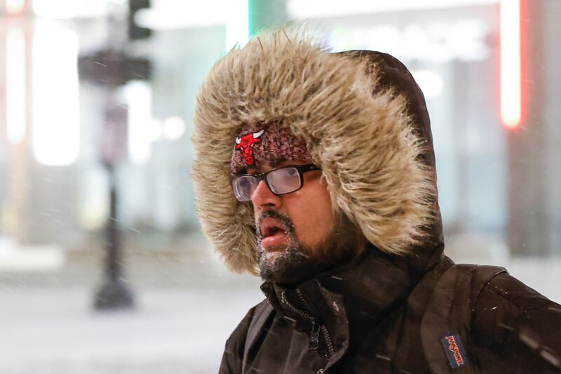 A pedestrian clad for the freezing weather in Chicago. AFP