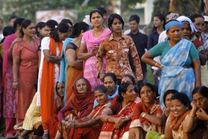 Nepalese women wait for their turn to cast their vote at a polling station in Bharatpur, some 90 kms south of Kathmandu on April 10, 2008. The United Nations appealed to Nepal's former rebel Maoists and other parties to halt violence to ensure fair voting in the April 10 landmark polls on the Himalayan nation's future. AFP PHOTO/ Sajjad HUSSAIN