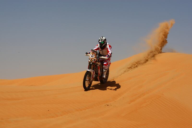 Cameron Waugh, a British expat from Dubai, was found by fellow rider Jakub Przygonski, from Poland, midway through the rally.  Courtesy Abu Dhabi Desert Challenge