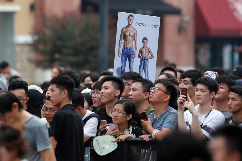 Fans react during the visit of Ronaldo. EPA