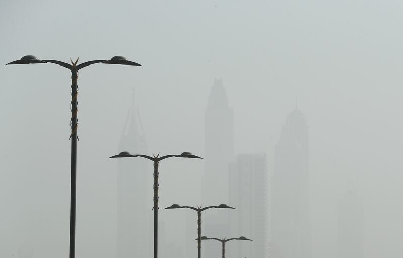 Towers in Dubai Marina as dust reduces visibility to a few hundred metres. Pawan Singh / The National