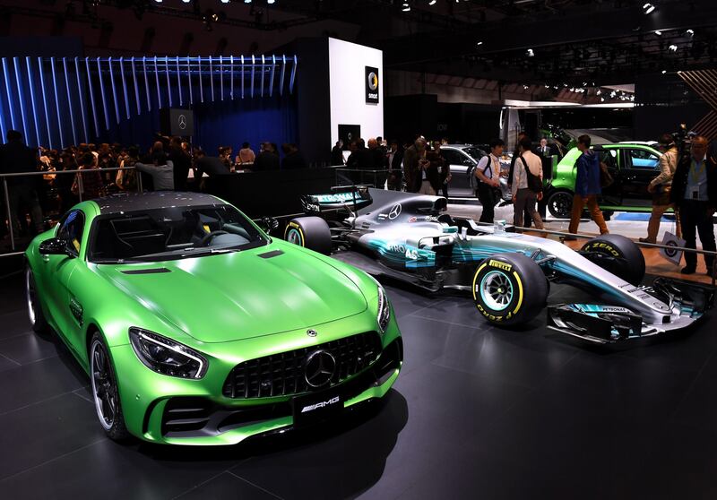 Mercedes-AMG GT R (L) and Mercedes F1 cars (R) at the Tokyo Motor Show. Toshifumi Kitamura/ AFP