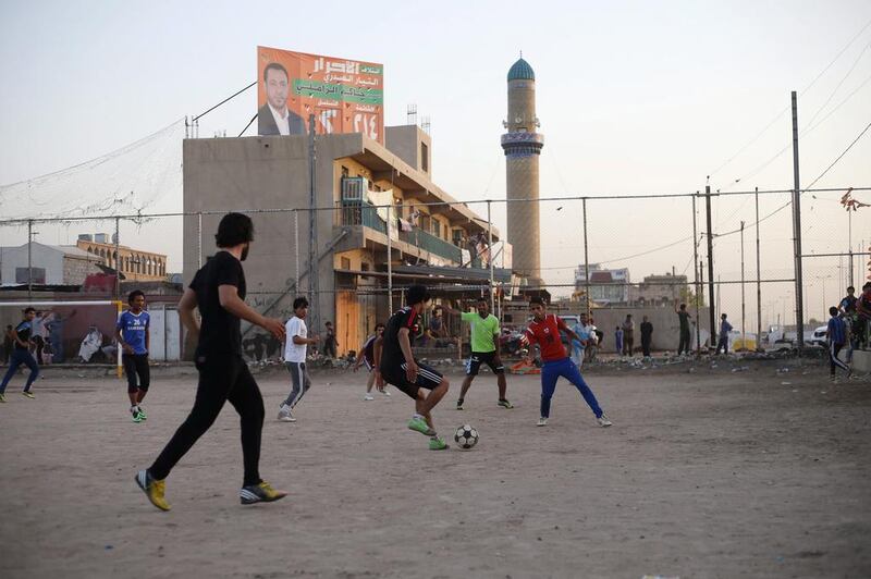 Iraqi Shi’ite youths play soccer in Sadr City.