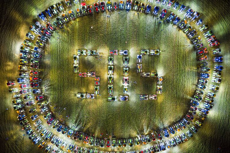 Farmers form a giant 'SOS' distress signal with their tractors in a co-ordinated stunt replicated in various locations across the country, in a field between the villages of Echallens and Goumoens-la-Ville, Switzerland. EPA