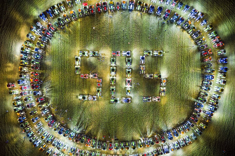 Farmers form a giant 'SOS' distress signal with their tractors in a co-ordinated stunt replicated in various locations across the country, in a field between the villages of Echallens and Goumoens-la-Ville, Switzerland. EPA