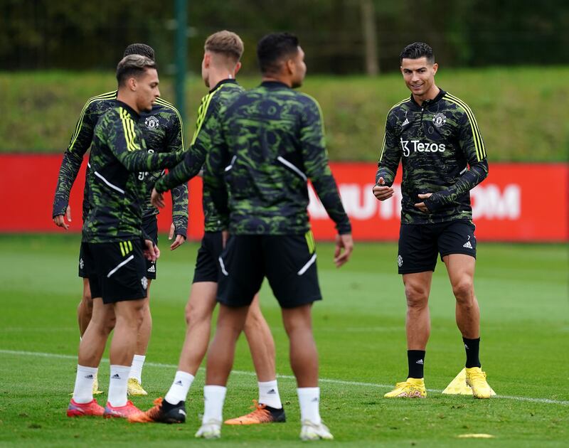 Cristiano Ronaldo takes part in training with Antony and other teammates. PA