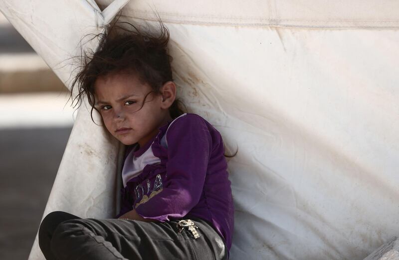A Syrian child is pictured at a refugee camp in Al Ghadfa, southeast of Idlib province. AFP