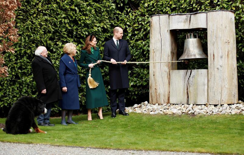 Prince William and Catherine, Duchess of Cambridge, ring the Peace Bell during a meeting with Ireland's President Michael D Higgins and his wife, Sabina. Reuters