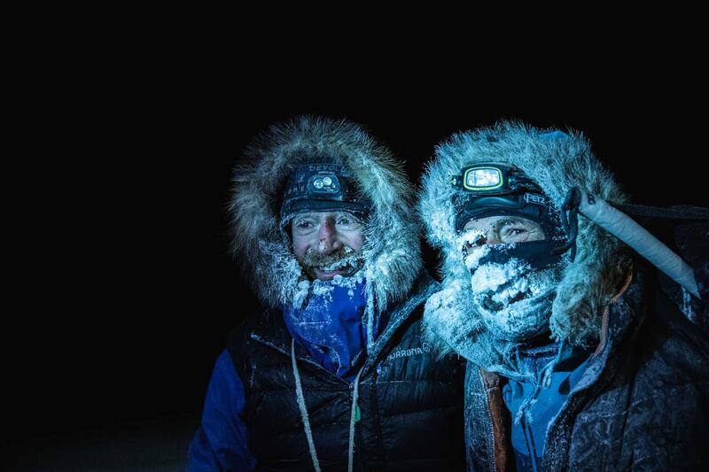 Borge Ousland of Norway and South African-born Swiss Mike Horn arrive at the Lance icebreaker boat after successfully crossing the frozen Arctic Ocean on skis. AFP