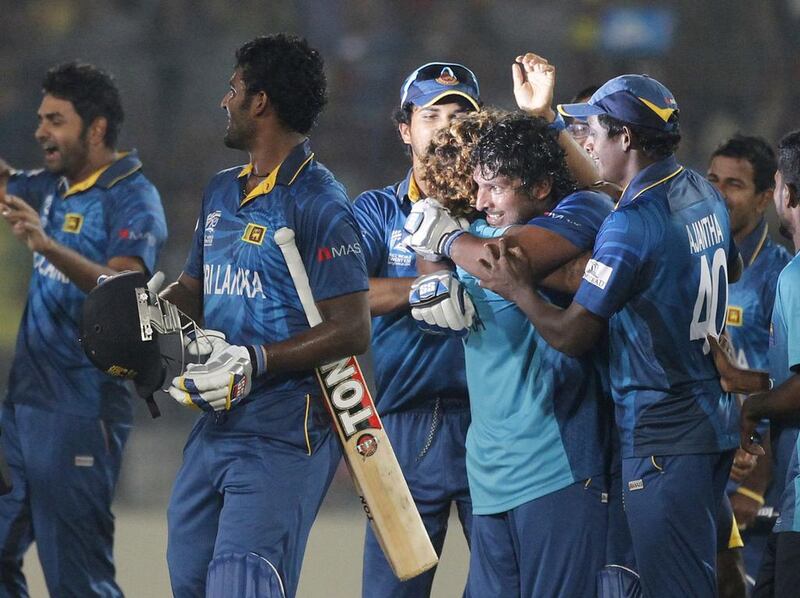 Sri Lanka's players celebrate after they won the ICC Twenty20 World Cup cricket title after beating India at the Sher-E-Bangla National Cricket Stadium in Dhaka April 6, 2014. REUTERS/Andrew Biraj (BANGLADESH - Tags: SPORT CRICKET)