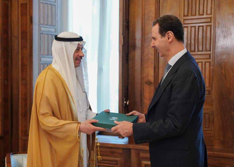 Saudi Arabia’s Ambassador to Jordan Nayef bin Bandar Al Sudairi hands Syrian President Bashar Al Assad an invitation to attend the 32nd session of the Arab League in the kingdom on May 19. Photo: Saudi Embassy in Jordan