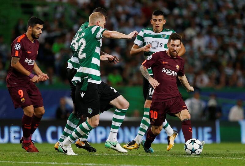 Barcelona’s Lionel Messi in action with Sporting’s Jeremy Mathieu. Pedro Nunes / Reuters