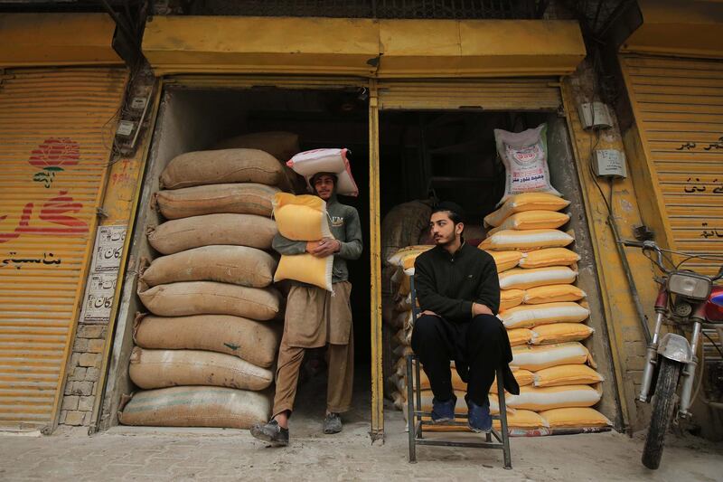 epa08146940 A man buys wheat flour from a sale point during wheat flour dealers strike in Peshawar, Pakistan, 21 January 2020.  Pakistani authorities on 20 January decided to import around 300,000 tons of wheat amid the shortage of commodity that is widely used in almost every household. Pakistan's flour crisis has become acute, affecting major cities such as Karachi, Hyderabad, and Lahore and with prices shooting up to 70 Pakistani Rupee a kilo in some areas.  EPA/BILAWAL ARBAB
