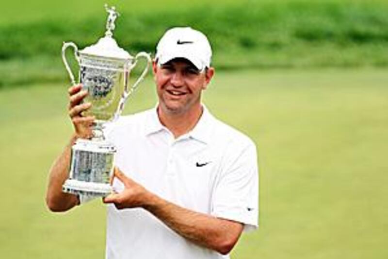 Lucas Glover celebrates with the trophy after his two-stroke victory at the US Open at Bethpage.