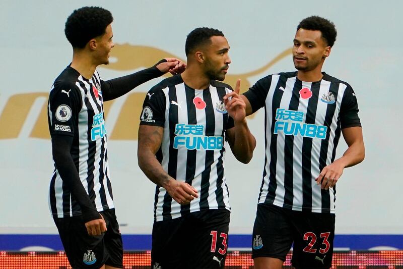 Newcastle United striker Callum Wilson, centre, celebrates after scoring the opening goal in his team's 2-1 victory over Everton on Sunday, November 1. AFP