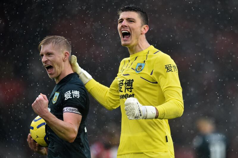 Burnley's Czech striker Matej Vydra (L) and Burnley's English goalkeeper Nick Pope react at the final whistle during the English Premier League football match between Southampton and Burnley at St Mary's Stadium in Southampton, southern England on February 15, 2020. RESTRICTED TO EDITORIAL USE. No use with unauthorized audio, video, data, fixture lists, club/league logos or 'live' services. Online in-match use limited to 120 images. An additional 40 images may be used in extra time. No video emulation. Social media in-match use limited to 120 images. An additional 40 images may be used in extra time. No use in betting publications, games or single club/league/player publications.
 / AFP / Glyn KIRK                           / RESTRICTED TO EDITORIAL USE. No use with unauthorized audio, video, data, fixture lists, club/league logos or 'live' services. Online in-match use limited to 120 images. An additional 40 images may be used in extra time. No video emulation. Social media in-match use limited to 120 images. An additional 40 images may be used in extra time. No use in betting publications, games or single club/league/player publications.
