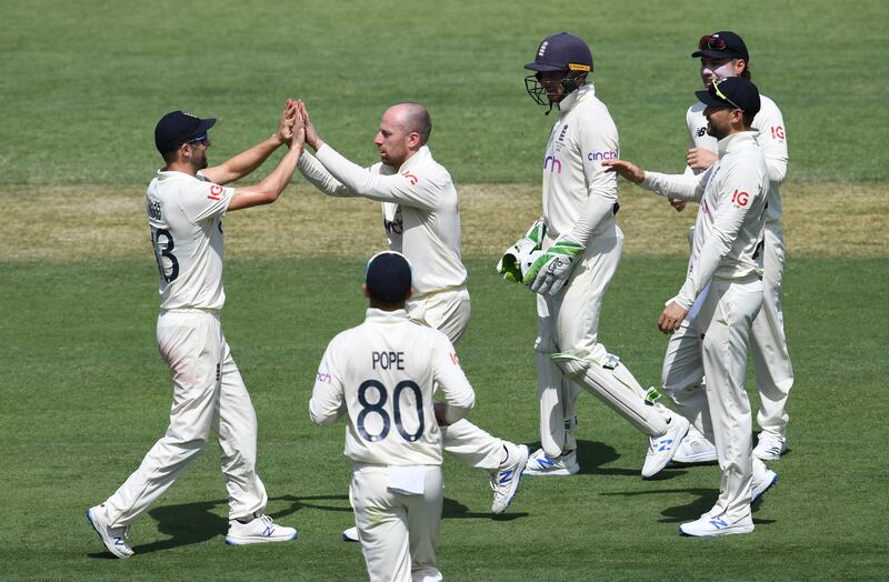 Jack Leach, centre, of England celebrates with teammates after getting the wicket of Marnus Labuschagne of Australia. EPA