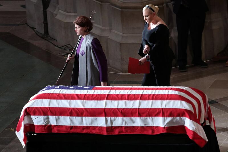 Daughter Meghan McCain walks past the casket at the memorial service of John McCain . Reuters