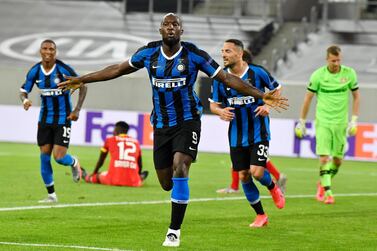 Inter Milan's Romelu Lukaku celebrates after scoring his side's second goal during the Europa League quarter finals soccer match between Inter Milan and Bayer Leverkusen at Duesseldorf Arena, in Duesseldorf, Germany, Monday, Aug. 10, 2020. (AP Photo/Martin Meissner)