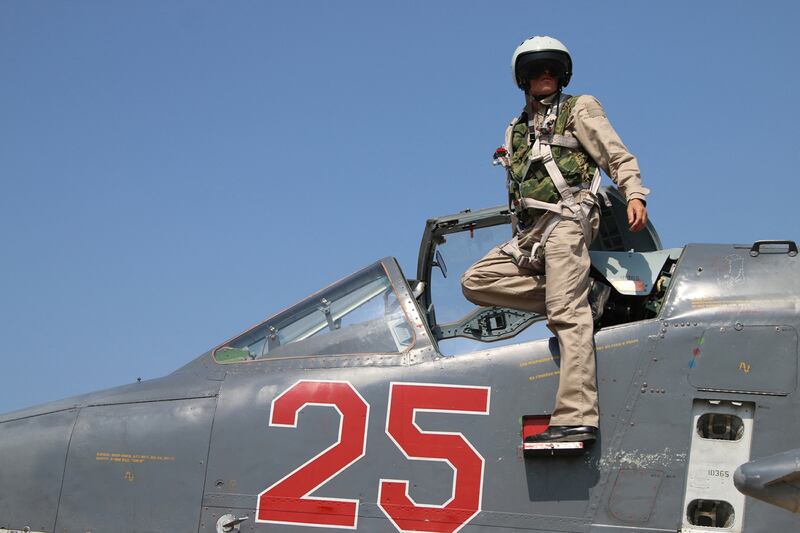 A Russian pilot leaving his Sukhoi Su-25 ground attack aircraft at Hmeimim airbase in the Syrian province of Latakia. AFP