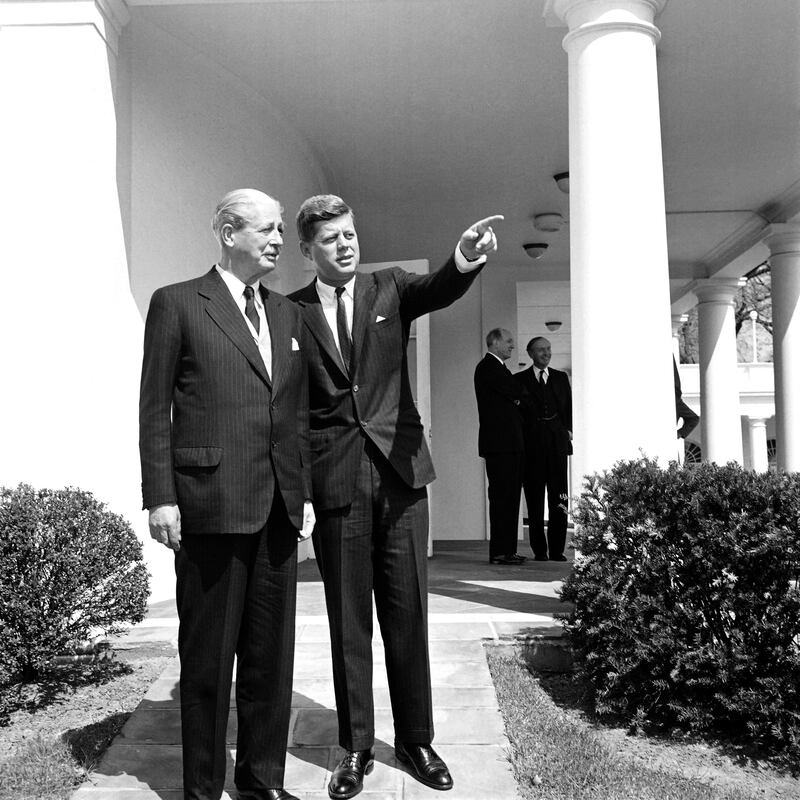 President John F Kennedy and British prime minister Harold Macmillan stand in the West Wing Colonnade on April 6, 1961. AFP