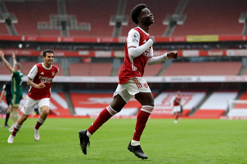 Arsenal's English striker Bukayo Saka celebrates scoring the opening goal during the English Premier League football match between Arsenal and Sheffield United at the Emirates Stadium in London on October 4, 2020. (Photo by Kirsty Wigglesworth / POOL / AFP) / RESTRICTED TO EDITORIAL USE. No use with unauthorized audio, video, data, fixture lists, club/league logos or 'live' services. Online in-match use limited to 120 images. An additional 40 images may be used in extra time. No video emulation. Social media in-match use limited to 120 images. An additional 40 images may be used in extra time. No use in betting publications, games or single club/league/player publications. / 