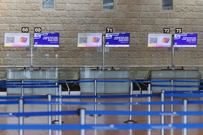 Empty desks in the departure terminal at Ben Gurion International Airport in Israel on Sunday morning. Photo: Bloomberg