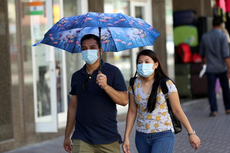 Dubai, United Arab Emirates - Reporter: N/A. News. Coronavirus/Covid-19. Two people wear masks to curb the spread of the coronavirus in Satwa, Dubai. Tuesday, October 20th, 2020. Dubai. Chris Whiteoak / The National