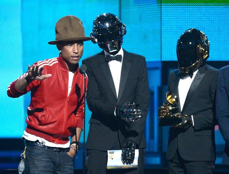 Pharrell Williams, Thomas Bangalter, and Guy-Manuel de Homem-Christo of Daft Punk accept the Best Pop Duo/Group Performance award for 'Get Lucky' during the 56th Grammy Awards.   Kevork Djansezian / Getty Images /AFP

