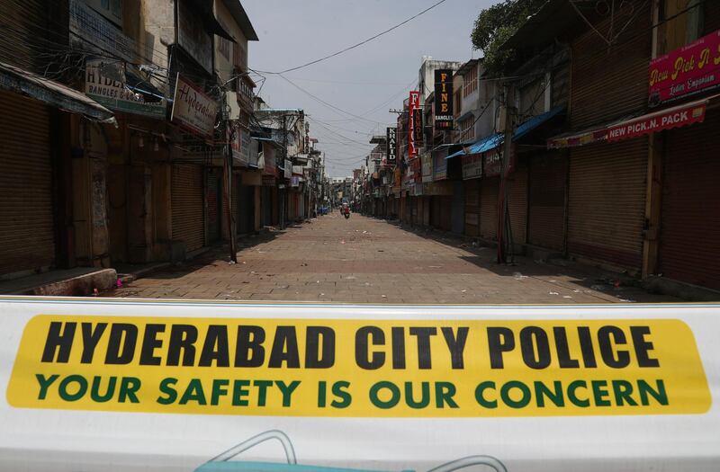 A sign is displayed at a closed market during lockdown in Hyderabad, India. AP