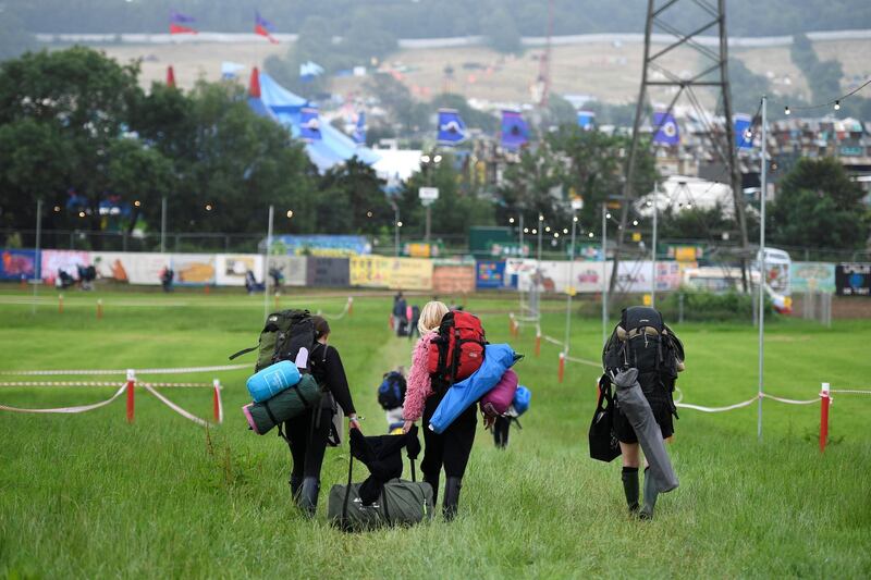 GLASTONBURY, ENGLAND - JUNE 26: Festival goers arrive as the gates open during day one of Glastonbury Festival at Worthy Farm, Pilton on June 26, 2019 in Glastonbury, England. The festival, founded by farmer Michael Eavis in 1970, has become the largest greenfield music and performing arts festival in the world. Tickets for the festival sold out in just 36 minutes as it returns following a fallow year. (Photo by Leon Neal/Getty Images)