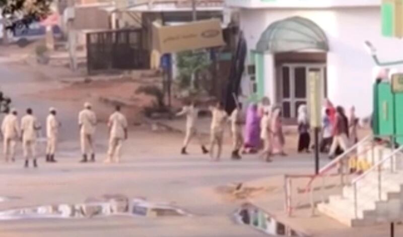 A video still shows Sudan Sudanese security forces moving against a protest sit-in camp in the capital Monday, witnesses and protest organizers said. Machine gun fire and explosions were heard and smoke rose from the area. AP