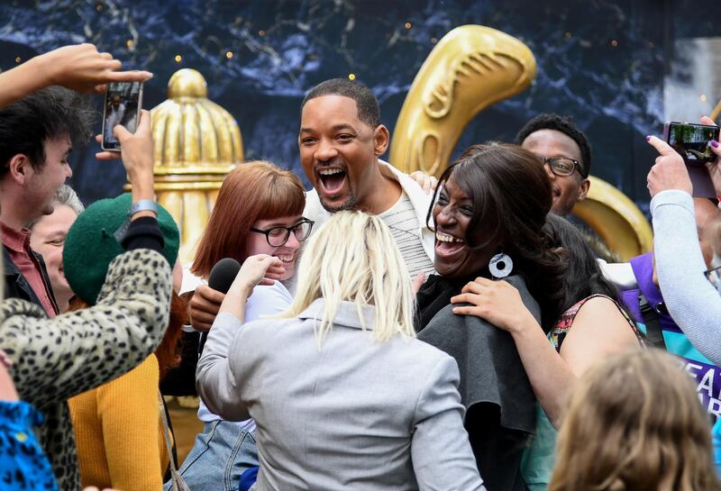 Will Smith attends a magic lamp stunt in London's Leicester Square, to the surprise and delight of fans. Getty Images.