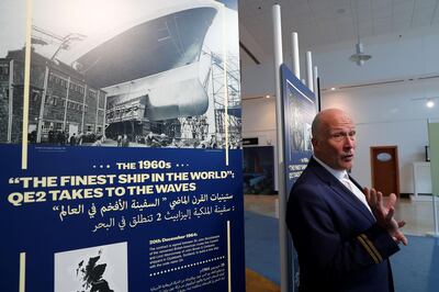 DUBAI , UNITED ARAB EMIRATES ,  October 15 , 2018 :- Peter Warwick, ex cruise director of the QE2 talking about some of the old photos during the interview at the reception area near the Queen Elizabeth 2 ship in Dubai. ( Pawan Singh / The National )  For Weekend. Story by Hala Khalaf