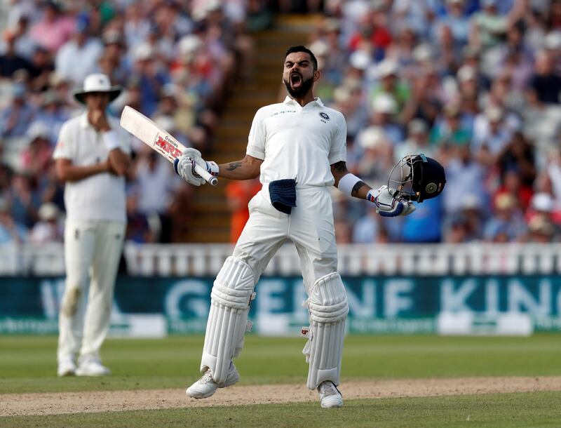 India's captain Virat Kohli celebrates scoring his century on the second day of the first Test cricket match between England and India at Edgbaston in Birmingham, central England on August 2, 2018. (Photo by ADRIAN DENNIS / AFP) / RESTRICTED TO EDITORIAL USE. NO ASSOCIATION WITH DIRECT COMPETITOR OF SPONSOR, PARTNER, OR SUPPLIER OF THE ECB