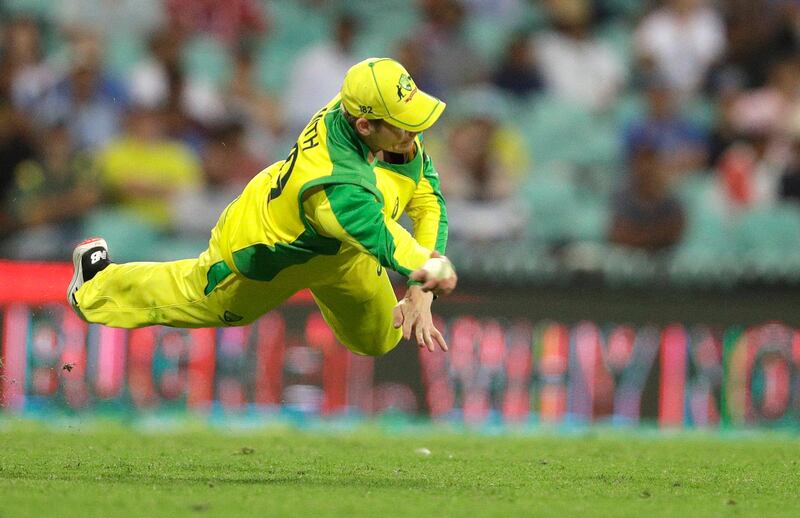 Australia's Steve Smith dives to field the ball during the first ODI against India in Sydney. AP