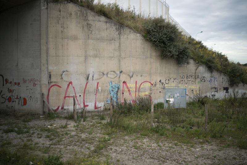 The Banksy Mural, showing the late Apple founder Steve Jobs migrating from Syria, at the entrance to the Calais Jungle has been sprayed over as nature takes back the area on September 10, 2018. Getty Images