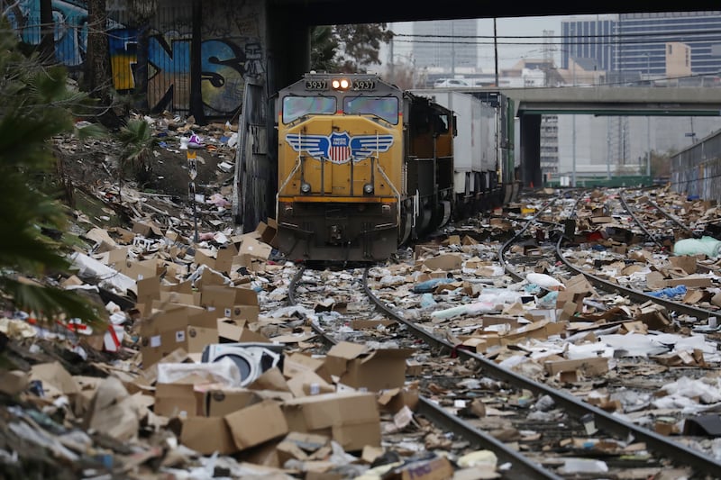 Thousands of opened packages litter the train tracks after being looted from a Union Pacific line hauling Fed Ex, Amazon, UPS and other box cars through the Lincoln Heights area of Los Angeles, California. EPA