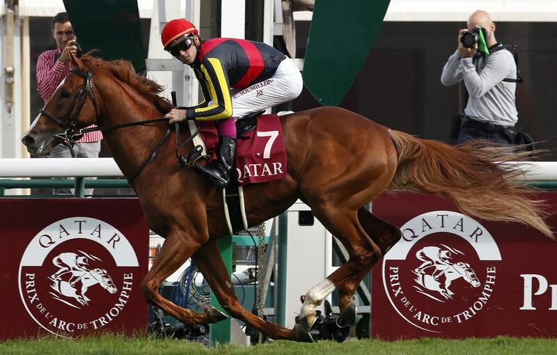 Belgian born jockey Christophe Soumillon riding Orfevre crosses the finish line to win the Prix Foy at the Longchamp race track in Paris. Francois Mori / AP Photo