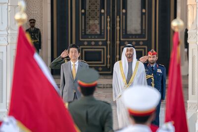 ABU DHABI, UNITED ARAB EMIRATES - January 13, 2020: HH Sheikh Mohamed bin Zayed Al Nahyan, Crown Prince of Abu Dhabi and Deputy Supreme Commander of the UAE Armed Forces (R) and HE Shinzo Abe, Prime Minister of Japan (L), stand for the national anthem during a reception at Qasr Al Watan.

( Eissa Al Hammadi for the Ministry of Presidential Affairs )
---